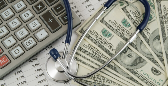 Image for The High Price of Health Insurance How to Find Affordable Coverage. A decorative image of a closeup of medical bills with a calculator, stethoscope, and several hundred dollar bills.