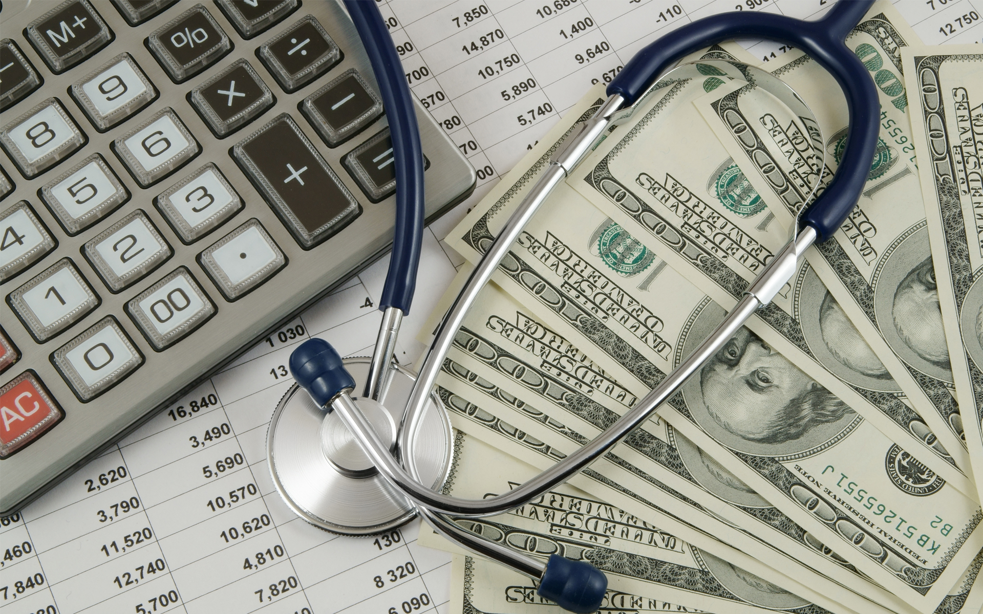 Image for The High Price of Health Insurance How to Find Affordable Coverage. A decorative image of a closeup of medical bills with a calculator, stethoscope, and several hundred dollar bills.